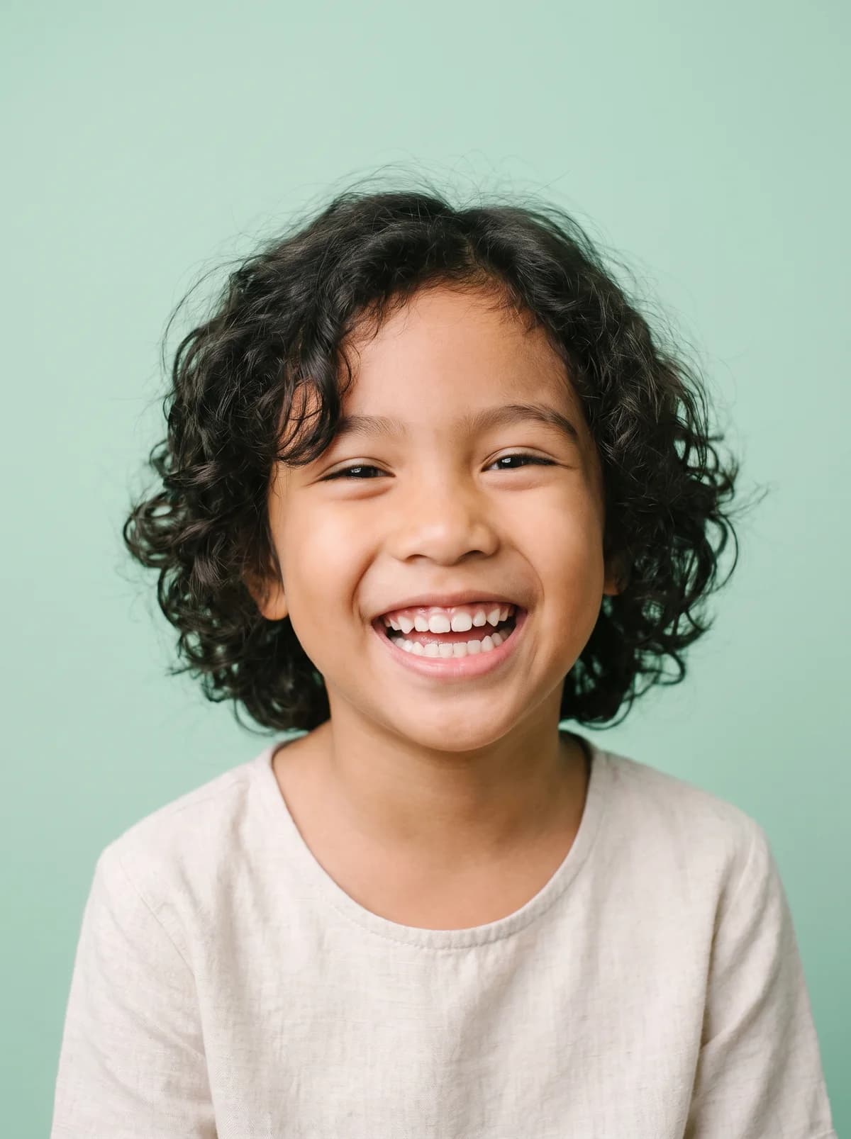 A child with a bright, healthy smile